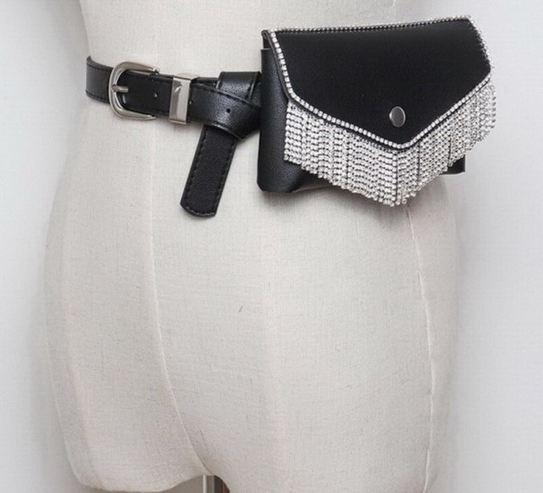 Ladies' belt bag made of artificial leather with a belt and sparkling stones Flat pocket with a flap secured by a snap Metal buckle 17.5 x 10.5 black