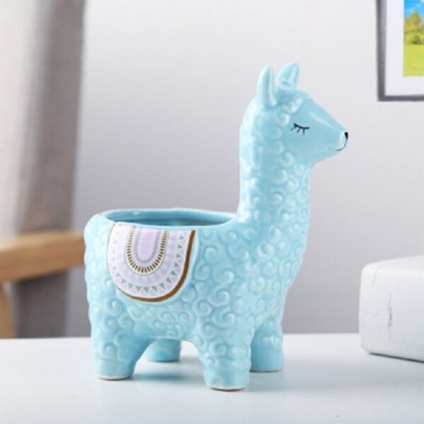 Maceta decorativa con forma de llama azul claro 1 Maceta decorativa con forma de llama azul claro 1