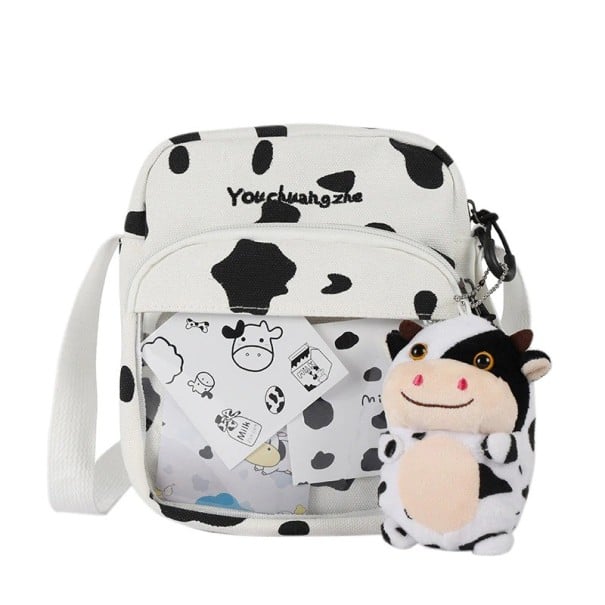 Mala de ombro feminina com padrão de vaca Branca com manchas pretas Bolso frontal com janela transparente Fecho com zíper Lona e poliéster 1