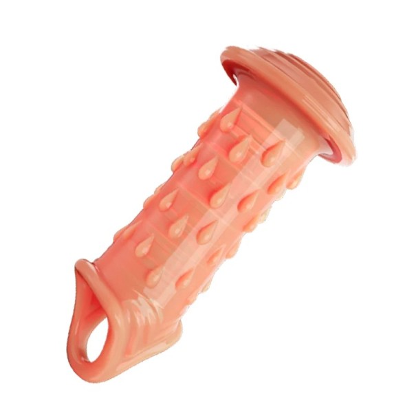 Manchon en silicone pour pénis avec une pointe élargie en forme de champignon et des anneaux de massage avec prise derrière les testicules dans le style d'un cockring Emballage discret couleur chair