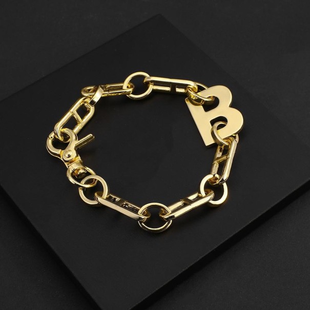 Massieve damesarmband met letter goud