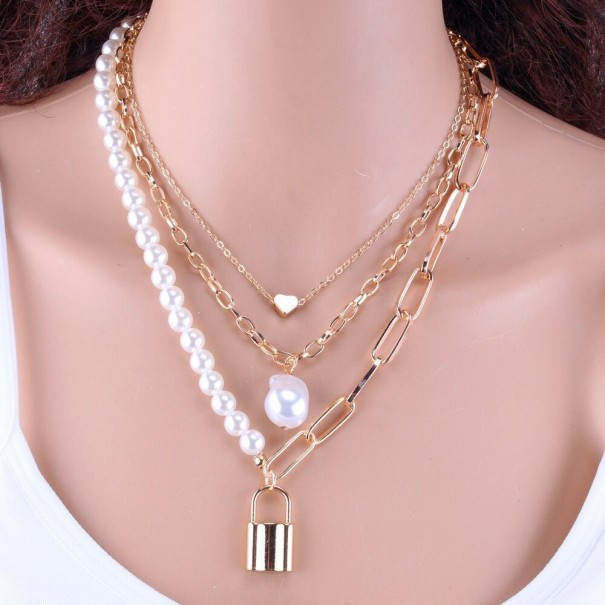 Massieve damesketting met parels en slot zilver