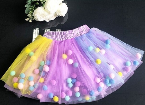 Meisjesrok met pompons L1001 multicolor 12-18 maanden