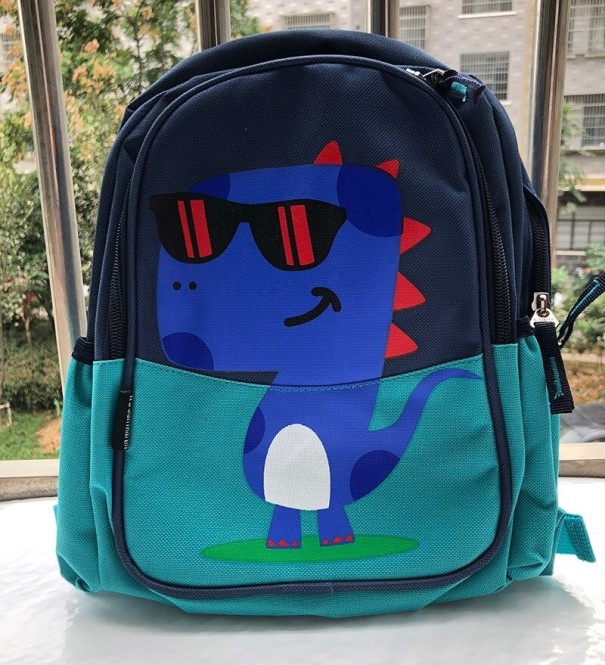 Mochila infantil com dinossauro turquesa