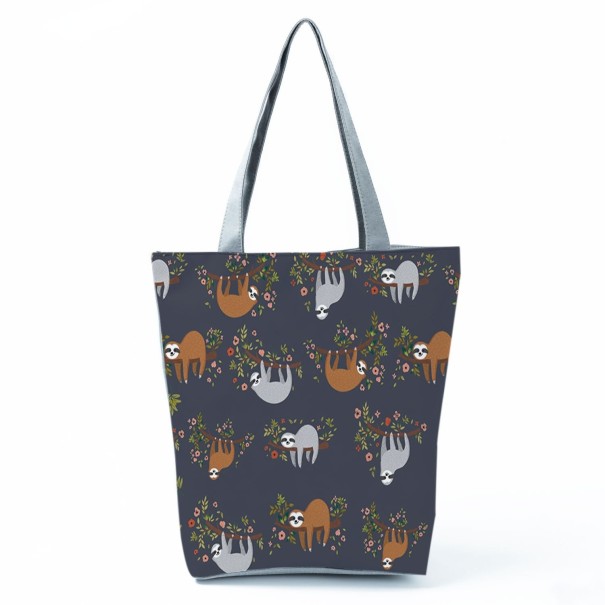 Naisten laukku laiskiaiskuvioilla Korkeampi muoto laajennetulla pohjalla 27 x 37 x 8 cm Pitkät harmaat kahvat Polyesteri Leikkisä piirretty 1