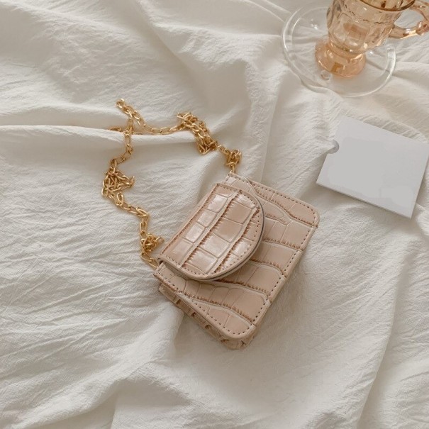 Naisten minikäsilaukku käärmeennahkakuviolla beige