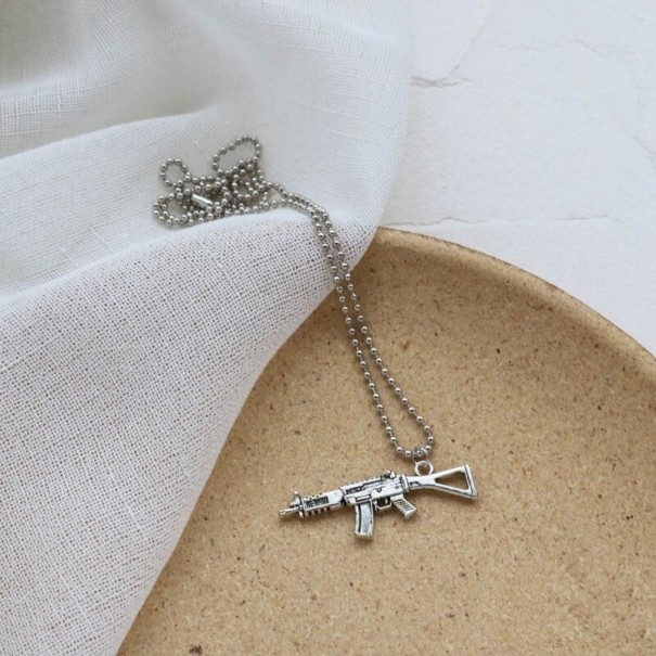 Naszyjnik damski z zawieszką w kształcie pistoletu 60 cm 6