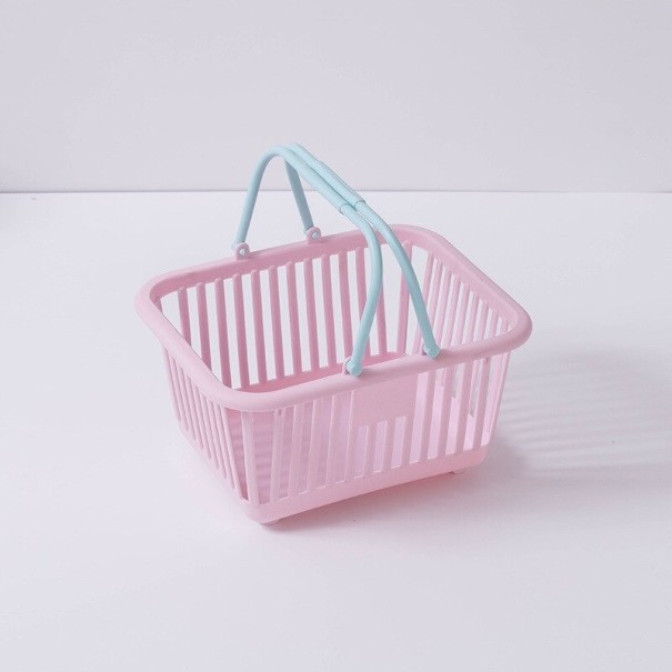 Organizador de plástico con forma de carrito de compra. rosa claro