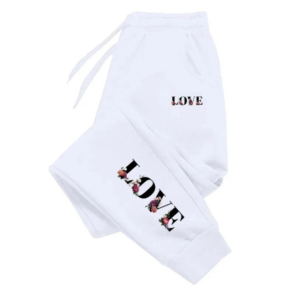 Pantalones de chándal para mujer con la inscripción LOVE en el lateral y en las perneras con cordón Poliéster Unicolor Cómodos y estilosos para el uso diario blanco XS