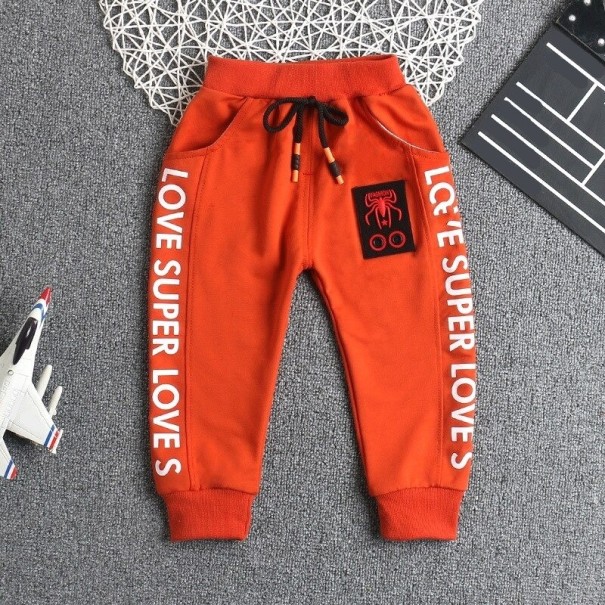 Pantaloni de trening pentru băieți L2257 portocale 9-12 luni