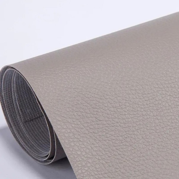 Plastic autoadeziv pentru repararea pielii 50x137 cm Plastic rezistent pentru repararea canapelelor, scaunelor auto, genților și scaunelor din piele. gri Plastic autoadeziv pentru repararea pielii 50x137 cm Plastic rezistent pentru repararea canapelelor, scaunelor auto, genților și scaunelor din piele. gri