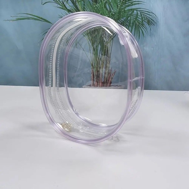 Průhledná taška na panenky kompaktní 13×10×5 cm PVC pro uložení a přenášení panenek, figurek a drobných hraček fialová