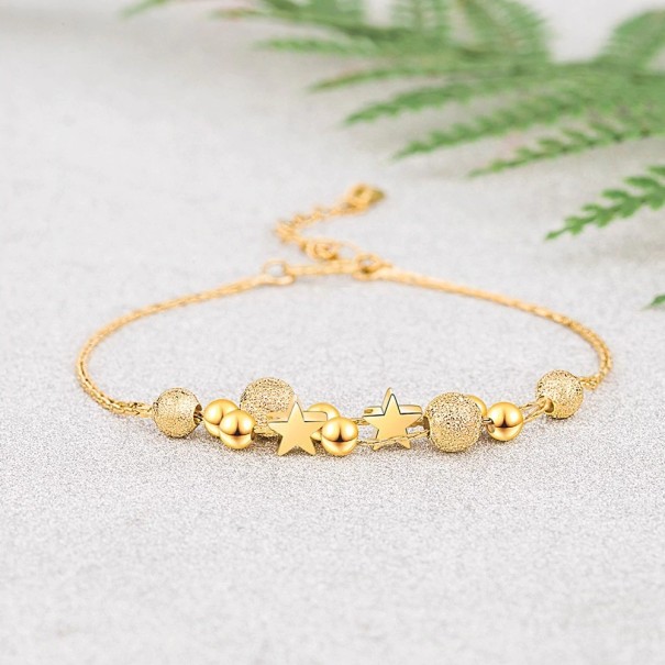 Pulsera de mujer con bolas y estrellas dorado