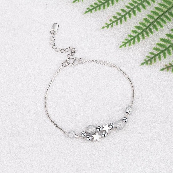 Pulsera de mujer con bolas y estrellas plateado