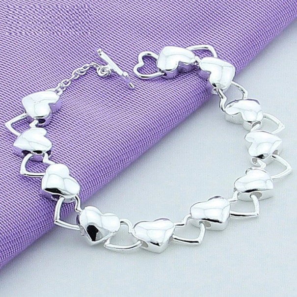 Pulsera de mujer con corazones en cierre americano 1