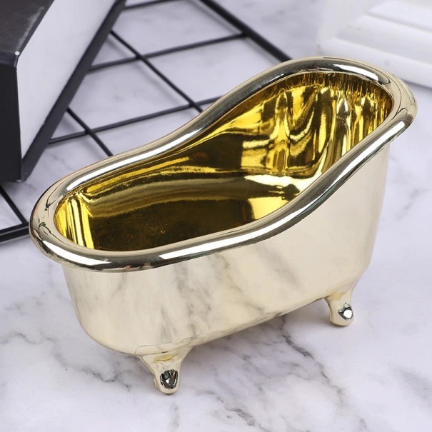 Ständer für Kosmetik und Schmuck in Form einer Badewanne golden