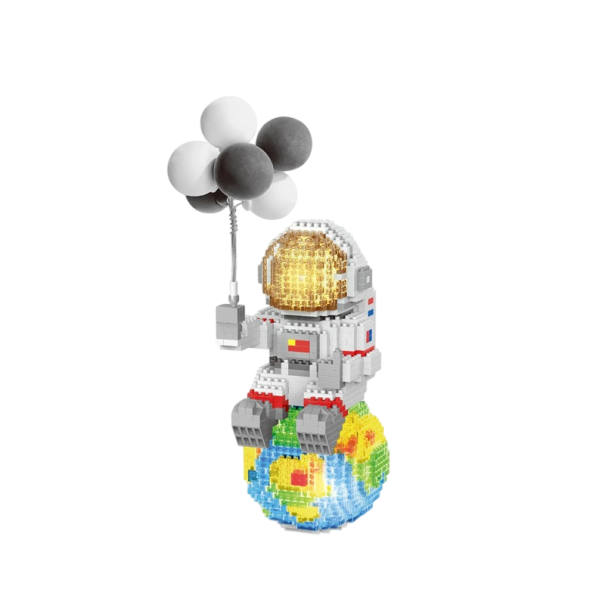 Stavebnica astronaut 20 x 9,5 x 8 cm Astronaut pe sitting pe Pământ cu baloane gri închis și albe Detalii mini blocuri Decorațiune spațială 1