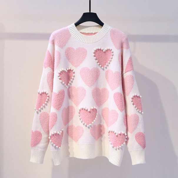 Suéter de mujer con corazones y perlas. rosa