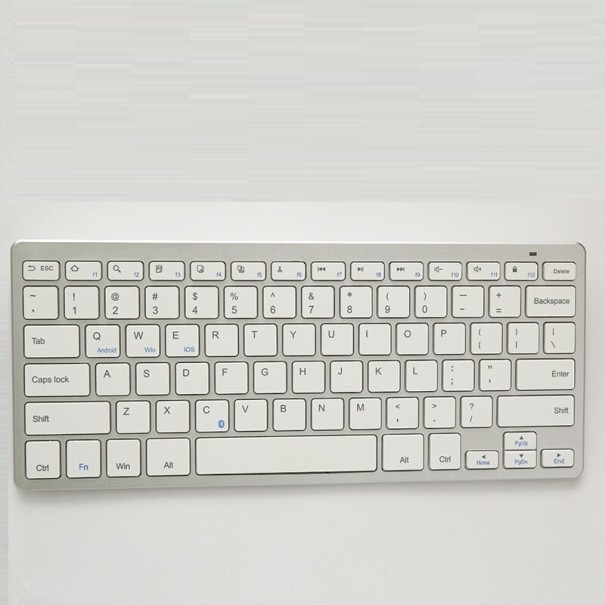 Teclado Bluetooth sem fios compacto sem parte numérica Teclas de membrana Alimentado por pilhas AAA Plástico prateado Dimensões 28,5 x 12,1 x 2,1 cm 1