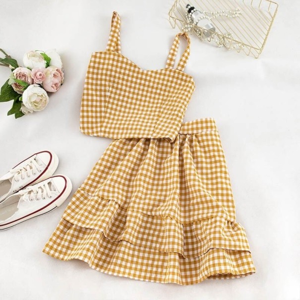 Top corto a quadri da donna e gonna giallo scuro