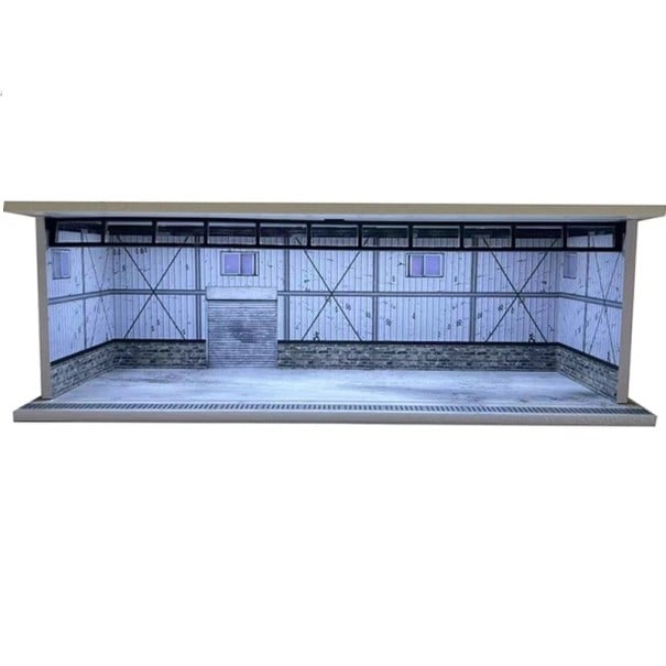Wystawowa diorama garaż 30 x 13,5 x 10 cm Skala 1:64 Metalowa hala serwisowa z kamiennym pasem Rolowane bramy Model parkingu 1