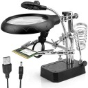 Tredjehands för lödning med LED-lampa och två förstoringsglas. Justerbart stativ med lödkolvshållare och USB-strömförsörjning. Flexibla armar. 1