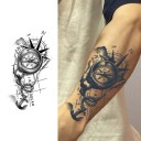Dekorativt temporärt kroppsetikett med kompass- och ankarmotiv Uttrycksfull svart design för arm, ben eller kropp 1