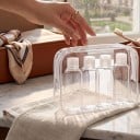 Set of 4 Travel Bottles 100 ml with Flip Top Cap Clear Zip Bag and Labels for Shampoo and Shower Gel 2
