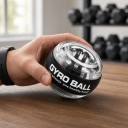 Bola de treino giroscópica com iluminação LED de cinco cores e autostart 7 x 5,5 cm Rotor metálico Transparente e preto Treinador de pulso 3