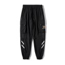 Cargo jogger byxor med elastisk midja och snörning Stora fickor med lock på låren Sidofickor Avsmalnande ben vid anklarna Polyester 3