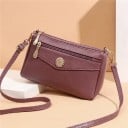 Dam liten crossbody väska med rund metalldekoration Framsidan med dragkedja Justerbar rem PU läder och polyester 22 x 15 x 8 cm 3