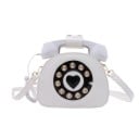 Dams crossbody-väska i form av en retrotelefon Nummerskiva med hjärta och hörlurar med snodd PU-läder och polyester 21 x 16 x 9 cm 1