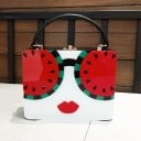 Damhandväska i form av en resväska av akryl för hand och över axeln Tryck med motiv av ett kvinnligt ansikte Avtagbar rem Metallknäppning 19 x 15 x 8