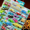 3D tarrat lapsille kulkuvälineillä Koholla olevat kiiltävät autot ja junat PVC:stä Tarran koko 1–4 cm 4 arkin setti 2