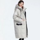 Dams lång quiltad vinterjacka med hög huva och snören Lösa snitt under knäna Kontrastfärgad svart dragkedja Sidofickor 100% polyester 3