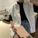 Dam oversize jeansskjorta utan ärmar Skjortkrage Knäppning med knappar Två stora fickor med lock Sänkta axlar Bomull och polyester 3