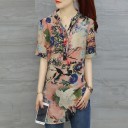 Damblus med blommönster och kort ärm Förlängd passform V-ringning Rundad nederkant Blandning av polyester, akryl och spandex 7