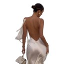 Abiti lunghi da donna con spalline sottili, schiena scoperta e scollatura arricciata con fiocchi decorativi e superficie lucida di colore bianco 11