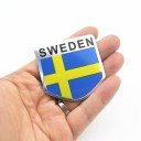 Autocollant 3D avec le drapeau de la Suède pour les fans de Scandinavie Émblème en relief avec bord argenté Surface brillante aux couleurs 4