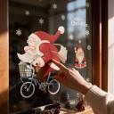 Autocollants de Noël pour fenêtre Réutilisables Santa Claus à vélo avec panier Inscription Joyeux Noël et flocons Rouge Décoration de vitrine 4