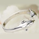 Bague pour femme avec des dauphins 2