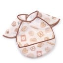 Baveta pentru bebeluși și copii mici 30 x 25 cm Mâneci peste umeri Model de patiserie pe fundal crem Margine de cacao și buzunar pentru resturi de mâncare 1