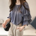 Blusa de mujer con mangas abullonadas 1