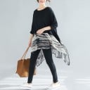 Blusa lunga da donna ampia con maniche lunghe Parte superiore nera e parte inferiore trasparente con motivo astratto Orlo asimmetrico a punte 2