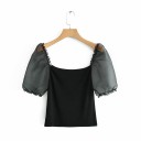 Blusa nera da donna con maniche trasparenti 1