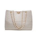 Bolso de mujer cruzado 32 x 25 x 15 cm Con asas de cadena doradas y cierre giratorio Patrón tejido a cuadros Forma rectangular 1