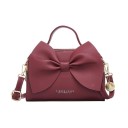 Borsa da donna con grande fiocco da portare a mano o a spalla Ecopelle Tracolla regolabile Chiusura con zip 23 x 15 x 7,5 cm Finiture 7