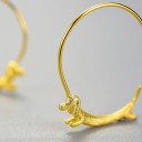 Boucles d'oreilles rondes pour femmes avec un blaireau 1