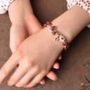 Bracciale a pallini da donna con fiori 1