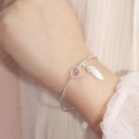 Bracciale da donna con pietra e piuma 3